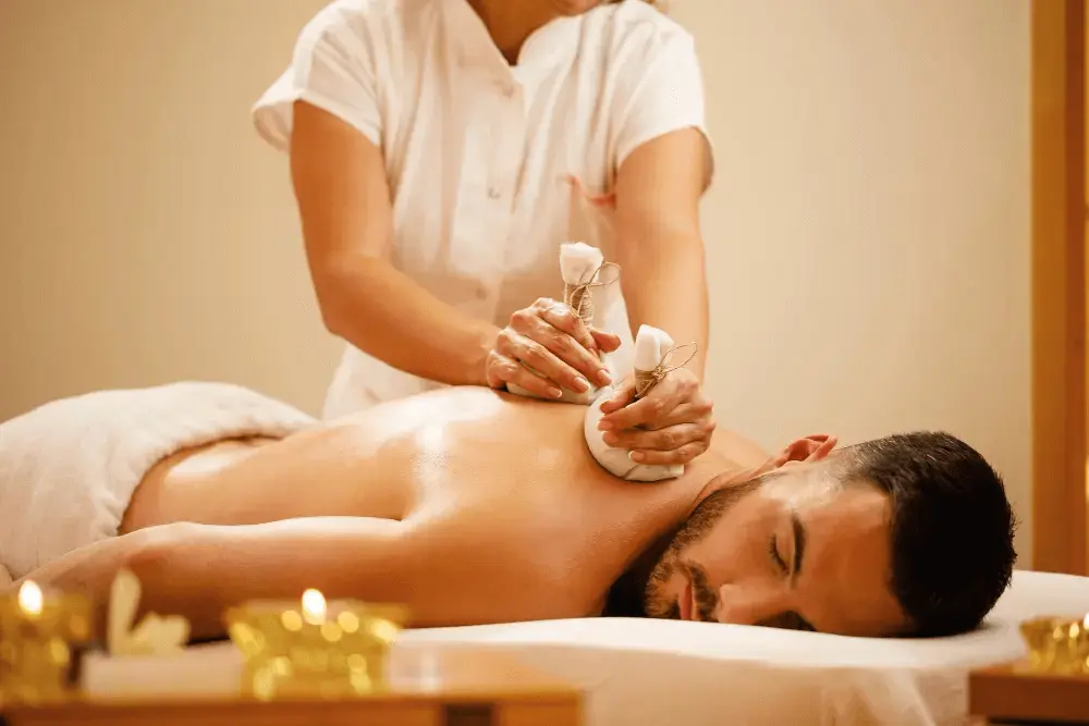 A man relaxing and enjoying back restoration massage