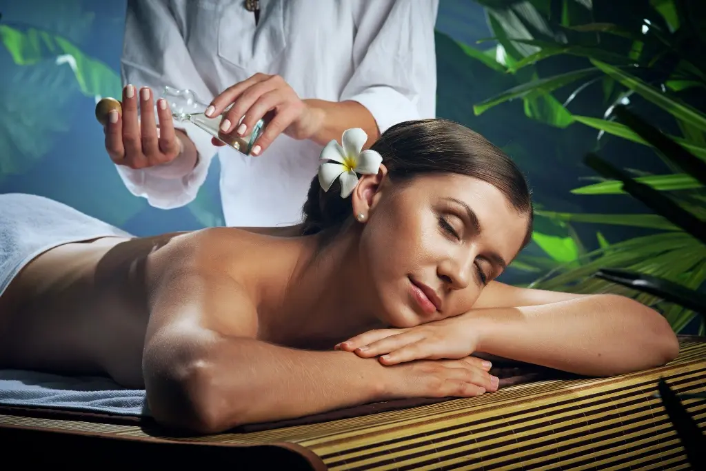 Scalp massage with essential oils to promote relaxation and healthy hair.