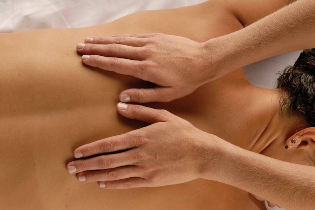 Spa Restoration Center showing Back Massage vs Full Body Massage techniques for pain relief and relaxation.