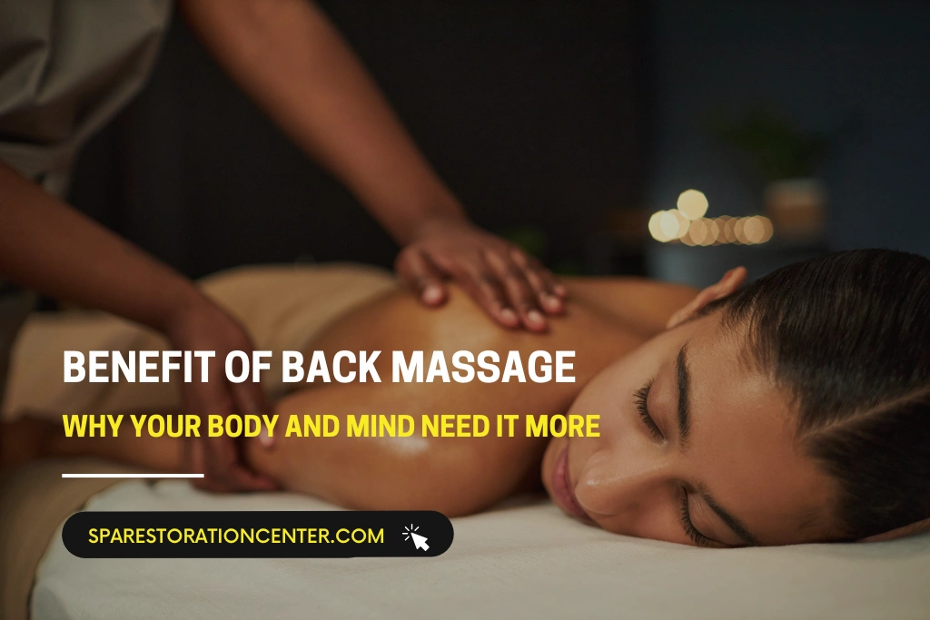 A woman lying face down on a massage table receiving a relaxing back massage from a professional therapist in a dimly lit spa setting.